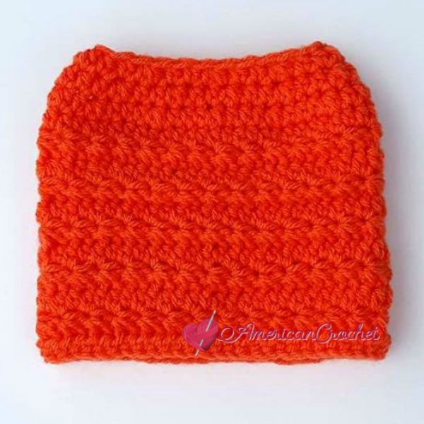 Radiant Stars Messy Bun Hat | Free Crochet Pattern | American Crochet @americancrochet.com #freecrochetpattern