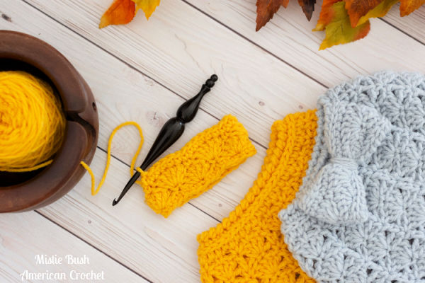 Gold and Gray hats with yarn bowl and crochet hook