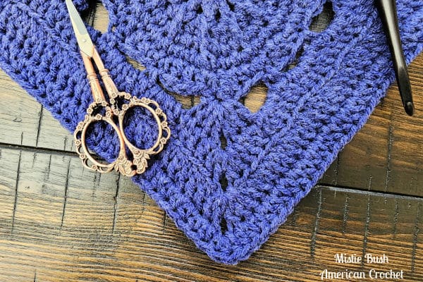 A detailed close-up of the Fritzella Square highlighting the textured combination of front post, back loop, and treble crochet stitches.