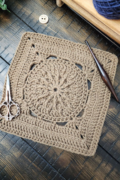 Durst Square crochet pattern – a 9-inch textured crochet afghan block featuring single, half double, double, and treble crochet stitches, plus back loop only, front post post techniques. Part of the Riverwood Square CAL 2025, this modern square is perfect for blankets, pillows, or standalone projects.