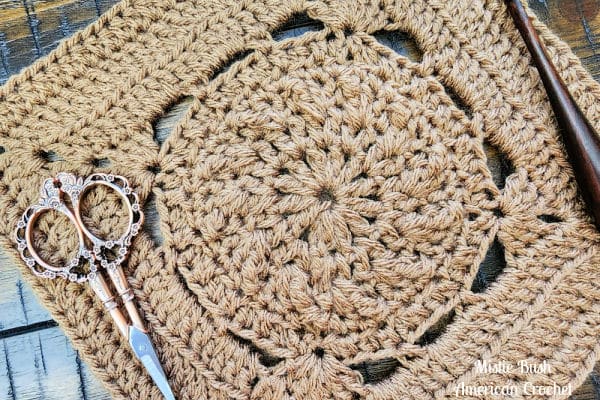 Close-up of the Bernard Square crochet pattern, highlighting front and back loop stitch textures combined with treble crochet rows for added height and definition.