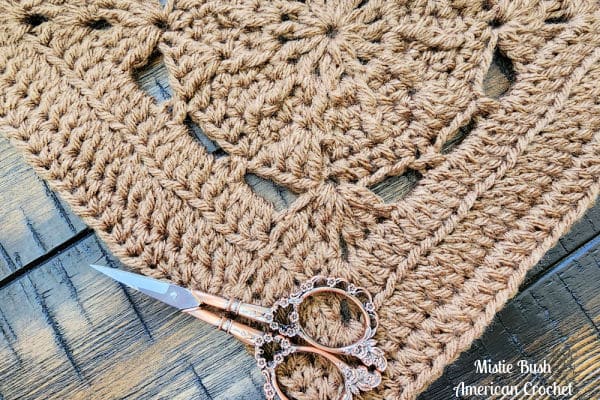 Close-up of the Hype Square highlighting stitch texture created with extended single crochet and front post double crochet.