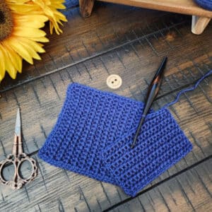 Flat lay of the Little Luminary Bonding Square crochet pattern in soft neutral yarn.